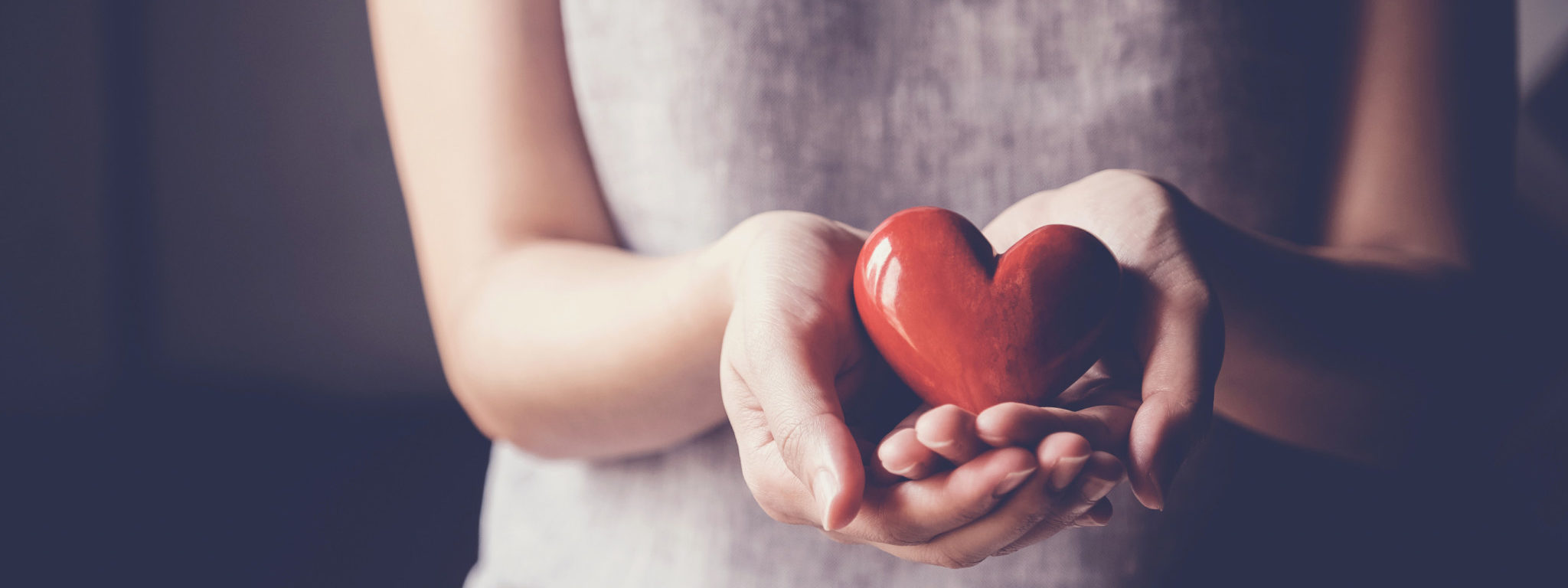 Asian woman holding red heart, health insurance, donation charity concept